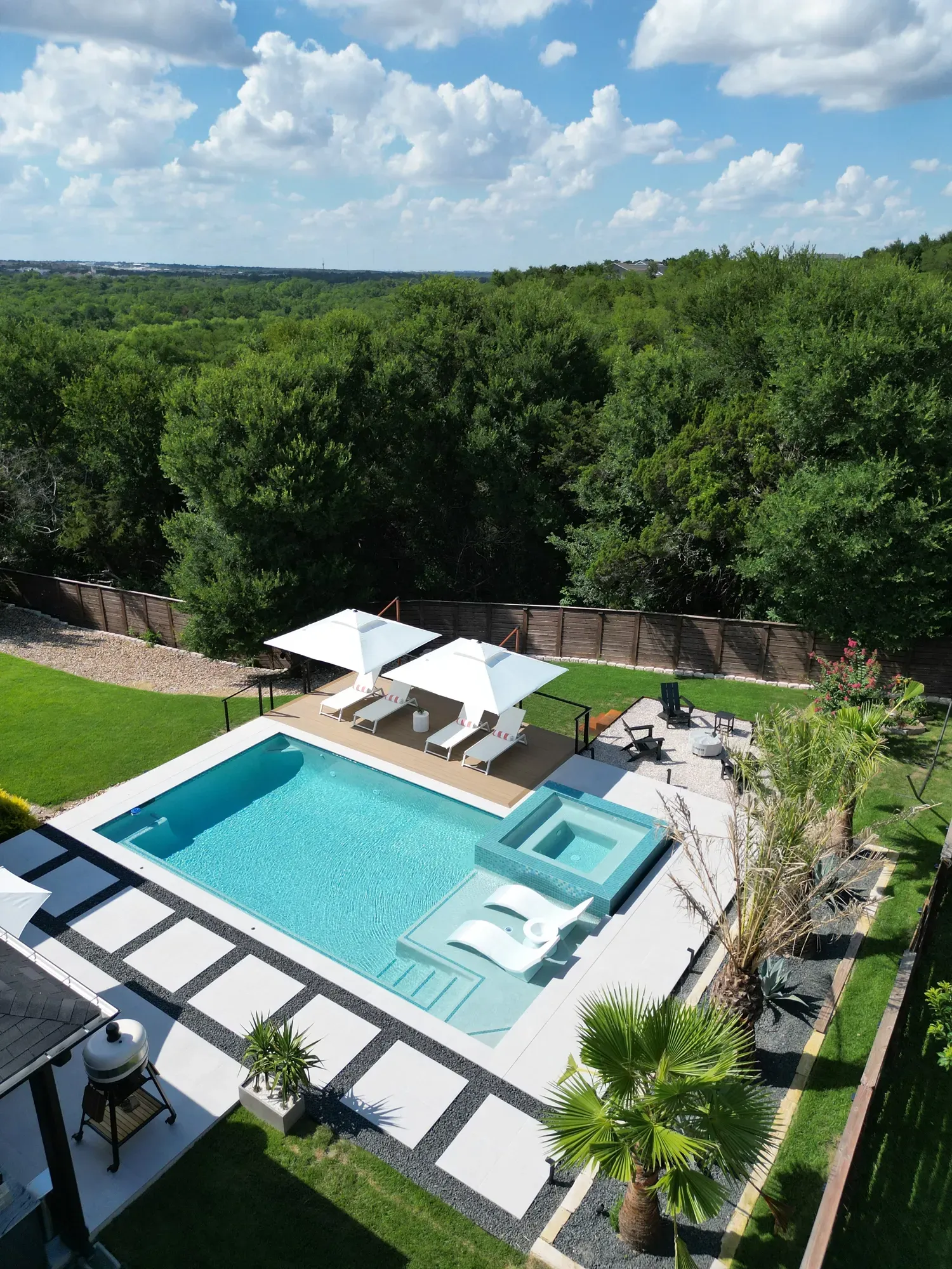 Long lap pool with tanning shelf in Westlake, TX